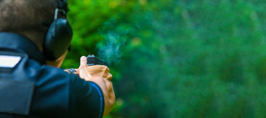 the man shooting with gun