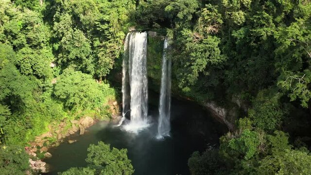 High aerial birds eye view pull back of Misol Ha waterfall in Mexico