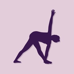 Fototapeta premium girl silhouette practising yoga in revolved triangle pose