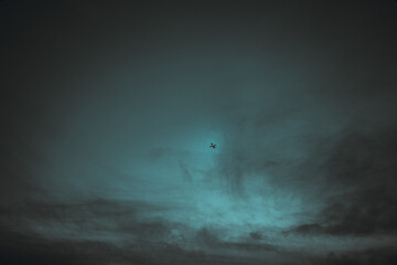 Plane in dark storm clouds