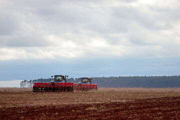 plowing machine harvesting on a sunny day