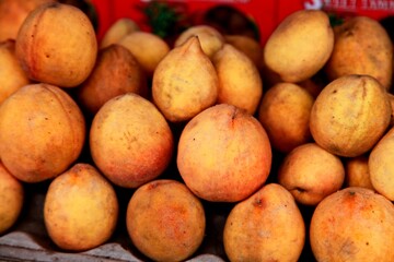 potatoes in a market fruits plum