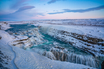 Gullfoss Waterfall in golden circle,  Iceland, in winter time, at sunset.
