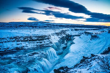 Gullfoss Waterfall in golden circle,  Iceland, in winter time, at sunset.
