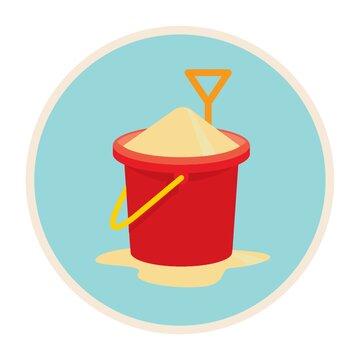 a bucket of sand with shovel