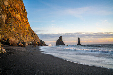 Reynisfjara, the black sand beach at vik, in Iceland, in winter  time, at sunset.
