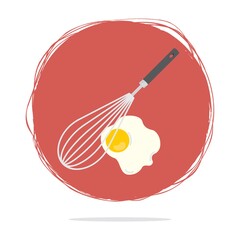 whisk with fried egg