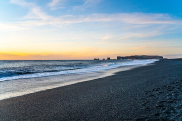 Reynisfjara, the black sand beach at vik, in Iceland, in winter  time, at sunset.