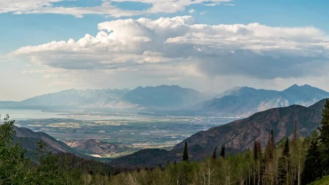 Overlooking Utah Valley from the Nebo Loop in time lapse as rainstorm moves over Timpanogos and Cascade Mountains up Provo Canyon.