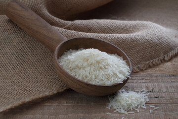 Indian basmati rice variety on a wooden background