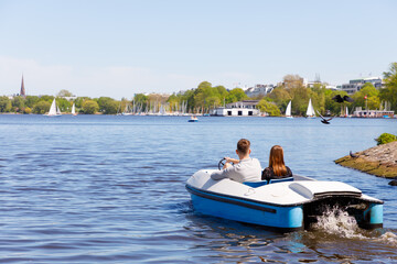 happy couple in pedal boat at Aussenalter, Hamburg