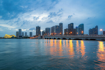 City of Miami Florida skyline and bay with night clouds. Miami night downtown.