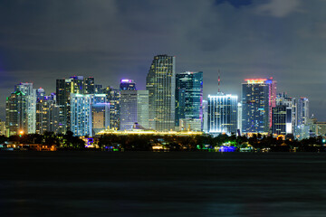 Fototapeta na wymiar Miami business district, lights and reflections of the city lights. Miami, Florida, USA skyline on Biscayne Bay, city night backgrounds.