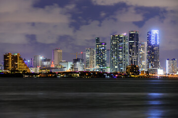 Fototapeta na wymiar Miami business district, lights and reflections of the city. Miami, Florida, USA skyline on Biscayne Bay, city night backgrounds.