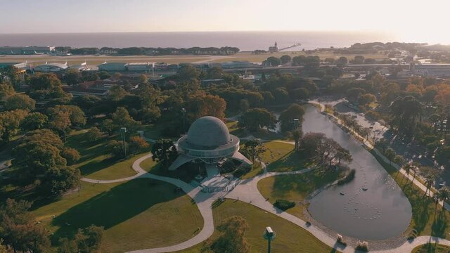 Aerial shot flying towards Galileo Galilei planetarium at sunrise in Buenos Aires