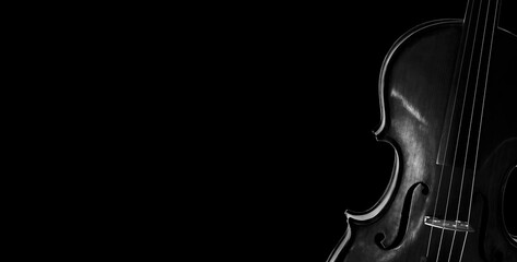 Fragment of a violin on a black background. Concert poster for classical music. Music concept....