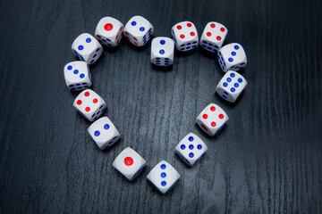 Gaming dice organized in heart symbol