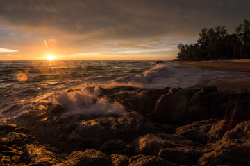 Sea sunrise among the rocks. Sea sunrise at thailand    