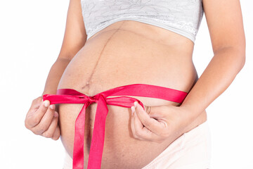 pregnant woman tied with a ribbon
