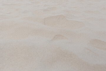 Fototapeta na wymiar Sand on the beach as background texture close up.