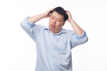 Young Fat Asian business man feeling sad with unhappy face isolated on white background.