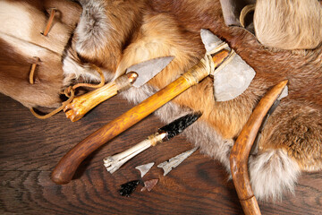 Stone Age Tools on wooden Background