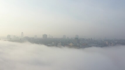 Aerial view of the city in the fog.