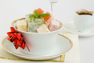 Traditional Turkish Delight on white background with Turkish Coffee.The Sugar Festival.