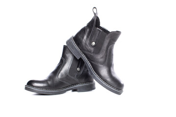 pair of black leather boots. classic autumn fashion boots black leather. isolated    