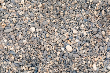 Small pebble stones on the beach. Abstract background