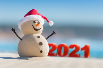 Sandy Christmas Snowman is welcoming the New Year of 2021 on a beautiful beach