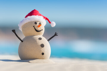Sandy Christmas Snowman is celebrating Christmas on a beautiful beach