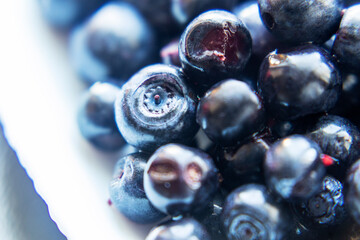 Closeup on fresh blueberries isolated on white background. Selective focus.