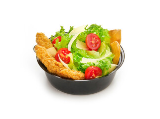 Caesar salad with lettuce, cherry tomatoes, parmesan and fried chicken in plastic bowl isolated on white background, fast food delivery concept for menu