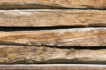 Grunge wood texture. Brown wooden log wall background. Rustic tree desk pattern. Countryside architecture wall. Village building construction.