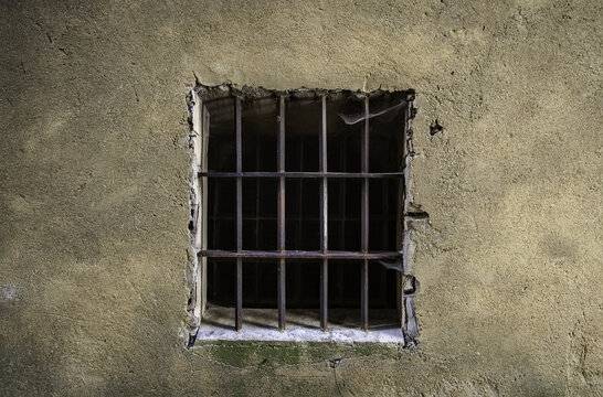 Old window with rusty bars