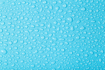 Water drops on a colored background. Raindrops, steam or condensation. Water drops background close up