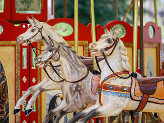 Fototapeta na wymiar carousel horse and horses