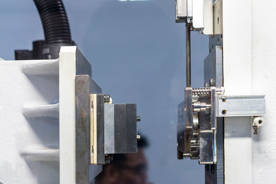 metal mould or plastic injection mold setup on high pressure injection molding machine for mass production or manufacturing in industrial