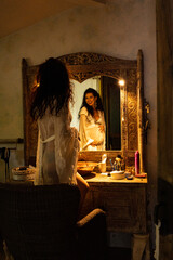 Amazing beautiful pregnant brunet woman portrait near wooden commode with mirror, Asian style