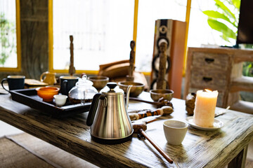 Fototapeta na wymiar silent meditation tea ceremony with singing bowls on wooden table background