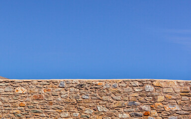 Stone brick wall and blue sky