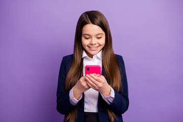 Portrait of her she nice small little focused cheerful cheery long-haired girl using device browsing social network news post isolated bright vivid shine vibrant lilac violet color background