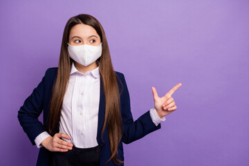 Portrait of nice small little long-haired girl wearing mask demonstrating copy space cov mers influenza disease medicine prevention isolated bright vivid shine vibrant lilac violet color background