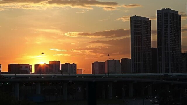 Sunset Over A Modern City, Sun Falls For Horizon. Time Lapse of Moscow city sunset, Russia
