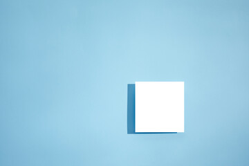 White empty blank card mockup on blue background. top view