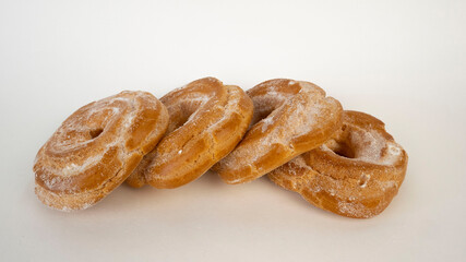 A lot of custard cake donuts close up.