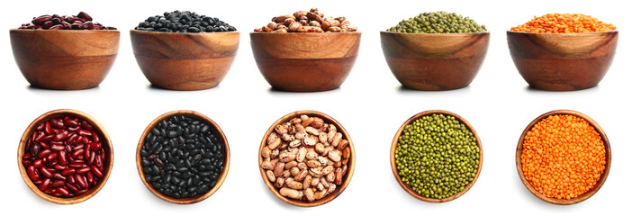 Bowls with different raw legumes on white background