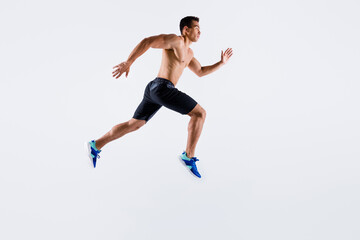 Fototapeta na wymiar Full length body size view of his he nice attractive professional sportive tall purposeful guy jumping running long distance motivation isolated over light white pastel color background