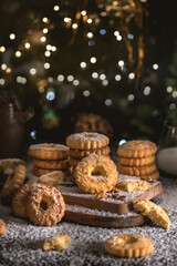 Sweet cookies with nuts in dark background